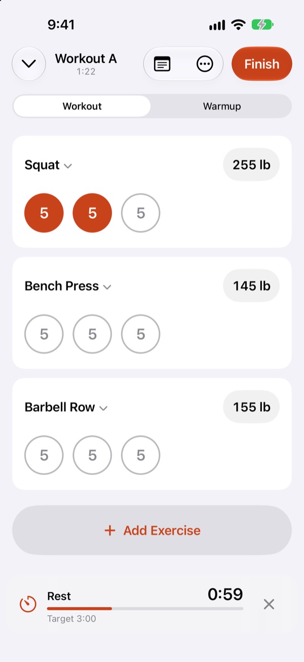 Workout screen with logged sets and the rest timer